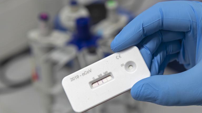 A scientist presents an antibody test for coronavirus in a laboratory of the Leibniz Institute of Photonic Technology (Leibniz IPHT) at the InfectoGnostics research campus in Jena, Germany, Friday, April 3, 2020. (AP Photo / Jens Meyer)