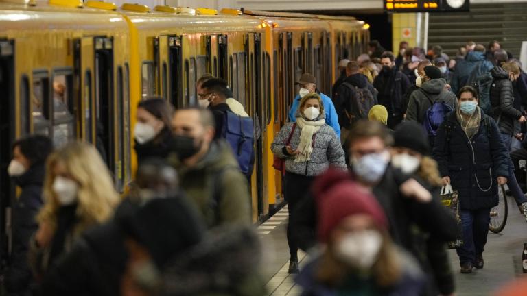 People wear face mask to protect against the coronavirus at the public transport station Friedrichstrasse in Berlin, Germany, Tuesday, Nov. 30, 2021. According to local authorities wearing face masks mandatory in public transport and passengers need to be vaccinated, recovered or tested negative of the coronavirus. (AP Photo/Markus Schreiber)