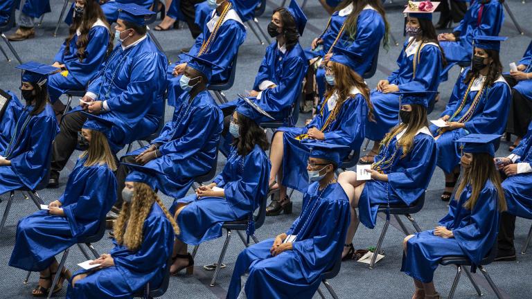 The 2021 graduating class of Odessa Career & Technical Early College High School listens as the salutatorian speaks during their graduation ceremony at Odessa College Sports Center on Friday, May 21, 2021 in Odessa, Texas. (Eli Hartman / Odessa American via AP)