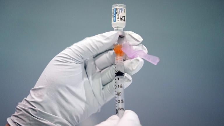 In this March 26, 2021, file photo a member of the Philadelphia Fire Department prepares a dose of the Johnson & Johnson COVID-19 vaccine at a vaccination site setup in Philadelphia. (AP Photo / Matt Rourke, File)