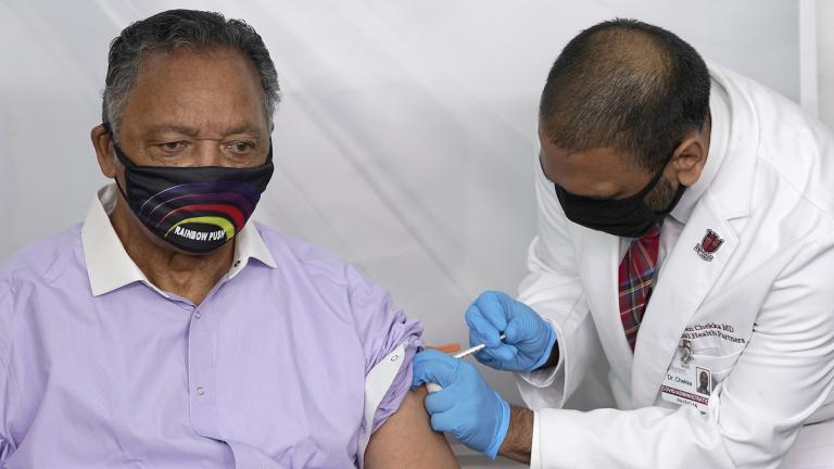 In this Friday, Jan. 8, 2021 file photo, Rev. Jesse Jackson receives the Pfizer’s BioNTech COVID-19 vaccine from Dr. Kiran Chekka, Covid Administration Physician at the Roseland Community Hospital in Chicago. (AP Photo / Charles Rex Arbogast, File)
