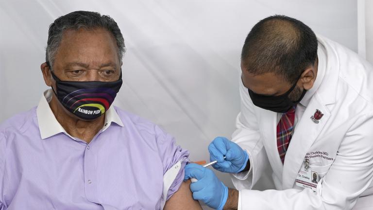 In this Friday, Jan. 8, 2021 file photo, Rev. Jesse Jackson receives the Pfizer's BioNTech COVID-19 vaccine from Dr. Kiran Chekka, Covid Administration Physician at the Roseland Community Hospital in Chicago. (AP Photo / Charles Rex Arbogast, File)