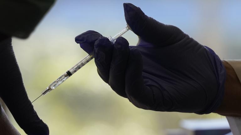 Registered Pharmacist Ken Ramey with CVS, prepares to give a COVID-19 vaccine, Thursday, Jan. 21, 2021, at the Isles of Vero Beach assisted and independent senior living community in Vero Beach, Fla. (AP Photo / Wilfredo Lee)