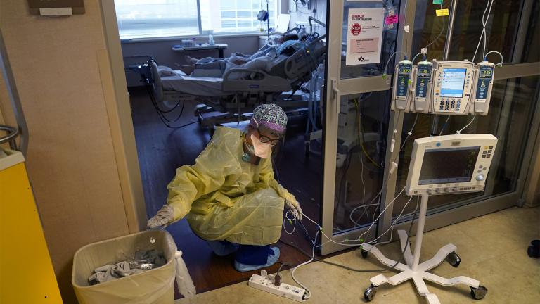 Jodie Ford, an ICU nurse, moves electrical cords for medical machines, outside the room of a patient suffering from COVID-19, in an intensive care unit at the Willis-Knighton Medical Center in Shreveport, La., Tuesday, Aug. 17, 2021. (AP Photo / Gerald Herbert)