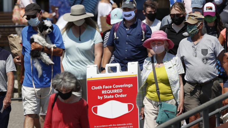 Passengers boards a Casco Bay Lines ferry bound for Peaks Island, Thursday, July 30, 2020, in Portland, Maine. State officials reported more cases of COVID-19. (AP Photo/Robert F. Bukaty)