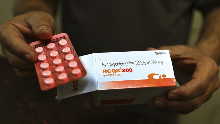In this April 9, 2020 file photo, a chemist displays hydroxychloroquine tablets in New Delhi, India. (AP Photo / Manish Swarup, File)