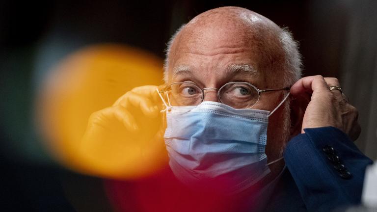 In this Wednesday, Sept. 16, 2020 file photo, Centers for Disease Control and Prevention Director Dr. Robert Redfield puts his mask back on after speaking at a Senate Appropriations subcommittee hearing on a “Review of Coronavirus Response Efforts” on Capitol Hill in Washington. (AP Photo / Andrew Harnik, Pool)