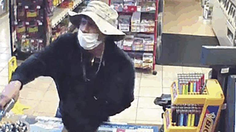 This March 26, 2020 image from surveillance video shows a man, believed to be William Rosario Lopez wearing a surgical mask, with a gun in a Connecticut convenience store. Reports are starting to pop up across the country, as well as in other parts of the world of crimes that were pulled off in no small part because so many of us are wearing masks. (U.S. District Court of Connecticut via AP) This March 26, 2020 image from surveillance video shows a man, believed to be William Rosario Lopez wearing a surgical mask, with a gun in a Connecticut convenience store. Reports are starting to pop up across the country, as well as in other parts of the world of crimes that were pulled off in no small part because so many of us are wearing masks. (U.S. District Court of Connecticut via AP)