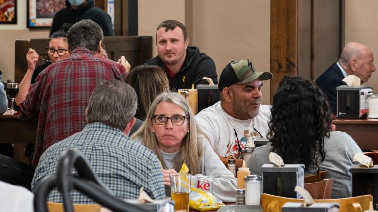 Patrons eat indoors at Philippe the Original restaurant in Los Angeles, Friday. Feb. 25, 2022. (AP Photo / Damian Dovarganes)