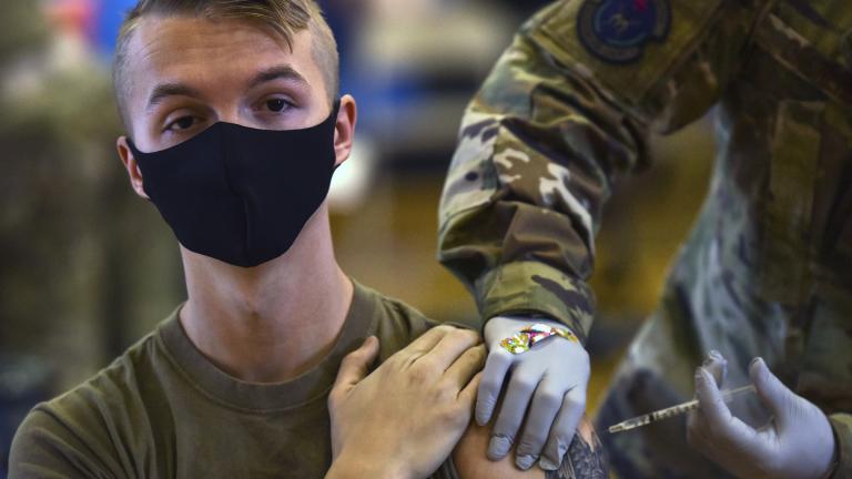 In this Feb. 9, 2021, file photo provided by the Department of Defense, Hickam 15th Medical Group hosts the first COVID-19 mass vaccination on Joint Base Pearl Harbor-Hickam. (U.S. Air Force Tech. Sgt. Anthony Nelson Jr. / Department of Defense via AP)