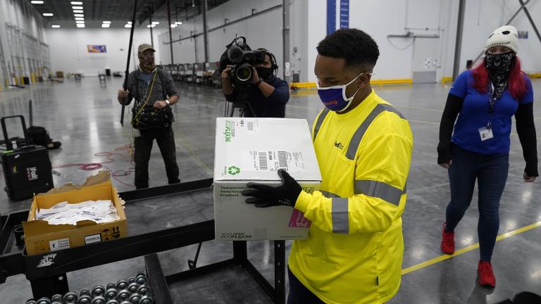 Boxes containing the Moderna COVID-19 vaccine are prepared to be shipped at the McKesson distribution center in Olive Branch, Miss., Sunday, Dec. 20, 2020. (AP Photo / Paul Sancya, Pool)