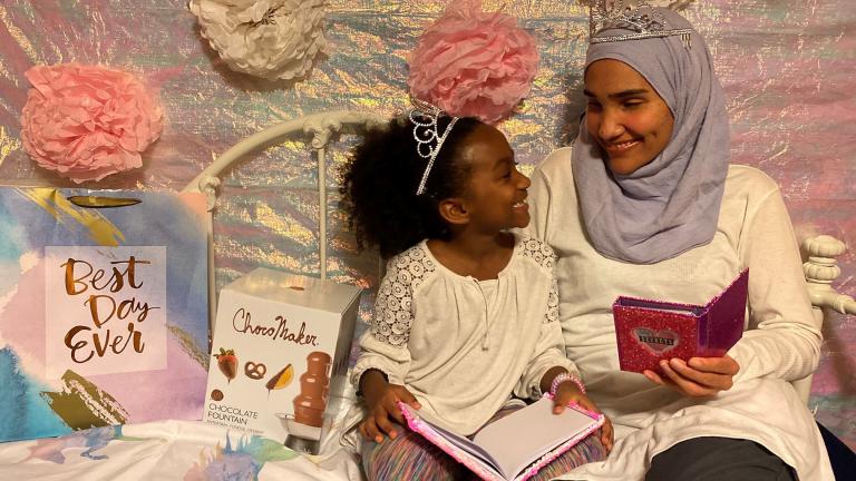 This undated photo shows Melissa Mueller-Douglas and her 7-year-old daughter, Nurah, at their home in Rochester, N.Y. with some of the items they plan to use for a Mother’s Day sleepover. (Yakub Shabazz via AP)