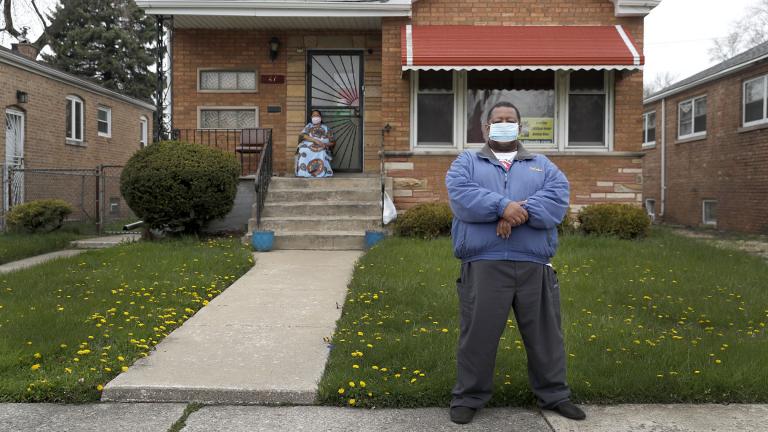 Anthony Travis, who has recovered from COVID-19 and lives with his sister, Jacqueline K. Johnson, background, and an adult daughter, poses for a portrait outside his Riverdale, Ill., home on Thursday, April 23, 2020. (AP Photo / Charles Rex Arbogast)