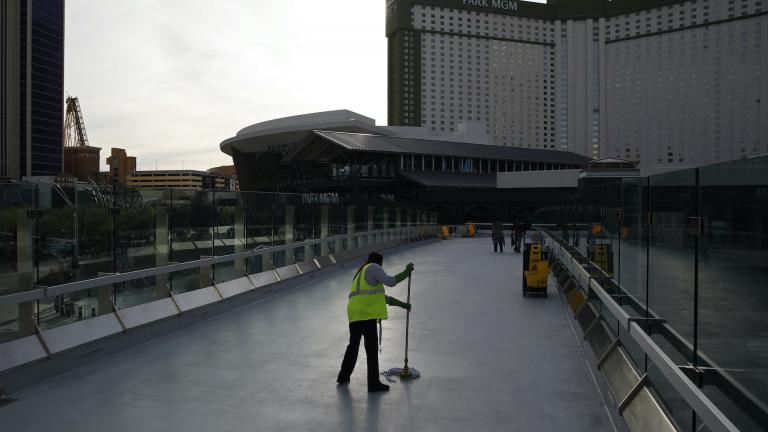 In this March 31, 2020, file photo, a worker cleans along the Las Vegas Strip devoid of the usual crowds as casinos and other business are shuttered due to the coronavirus outbreak in Las Vegas. (AP Photo/John Locher, File) In this March 31, 2020, file photo, a worker cleans along the Las Vegas Strip devoid of the usual crowds as casinos and other business are shuttered due to the coronavirus outbreak in Las Vegas. (AP Photo/John Locher, File)
