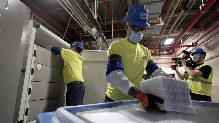Boxes containing the Pfizer-BioNTech COVID-19 vaccine are prepared to be shipped at the Pfizer Global Supply Kalamazoo manufacturing plant in Portage, Mich., Sunday, Dec. 13, 2020. (AP Photo / Morry Gash, Pool)