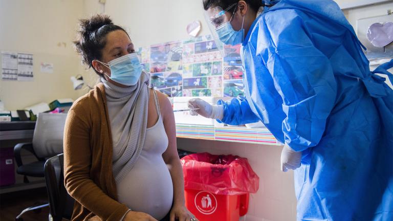 In this Wednesday, June 9, 2021 file photo, a nurse gives a shot of the Pfizer vaccine for COVID-19 to a pregnant woman in Montevideo, Uruguay. (AP Photo / Matilde Campodonico, File)