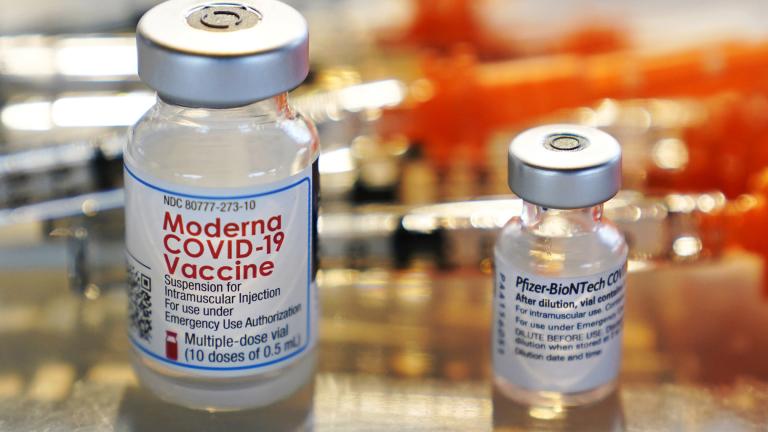 Vials for the Moderna and Pfizer COVID-19 vaccines are seen at a temporary clinic in Exeter, N.H. on Thursday, Feb. 25, 2021. (AP Photo / Charles Krupa, File)