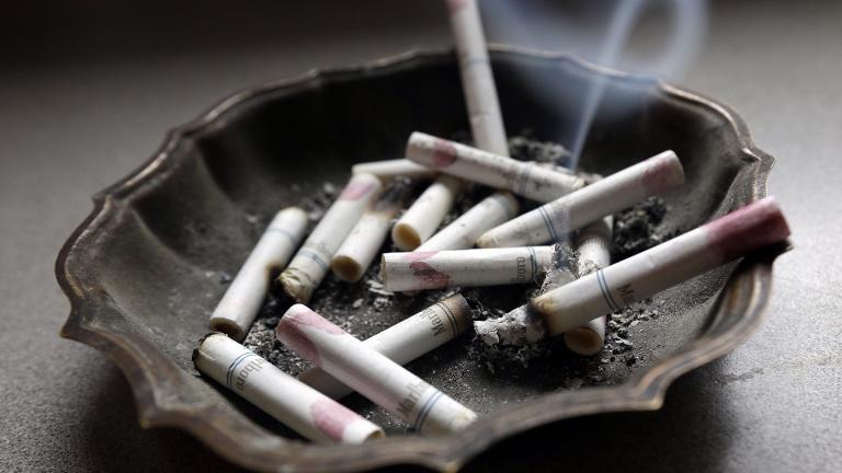 In this Saturday, March 2, 2013 file photo, a cigarette burns in an ashtray in Hayneville, Ala. (AP Photo / Dave Martin)