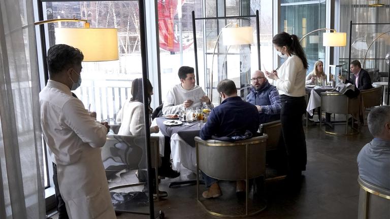 In this Jan. 27, 2021 file photo, patrons enjoy lunch indoors at Gibsons Italia restaurant in Chicago. A recent spike in coronavirus cases in some states has led one of the nation's top health experts to suggest that governors could “close things down” like they did during previous surges. But that doesn't appear likely to happen — not even in states led by Democratic governors who favored greater restrictions in the past. (AP Photo / Charles Rex Arbogast, File) In this Jan. 27, 2021 file photo, patrons enjoy lunch indoors at Gibsons Italia restaurant in Chicago. A recent spike in coronavirus cases in some states has led one of the nation's top health experts to suggest that governors could “close things down” like they did during previous surges. But that doesn't appear likely to happen — not even in states led by Democratic governors who favored greater restrictions in the past. (AP Photo / Charles Rex Arbogast, File)