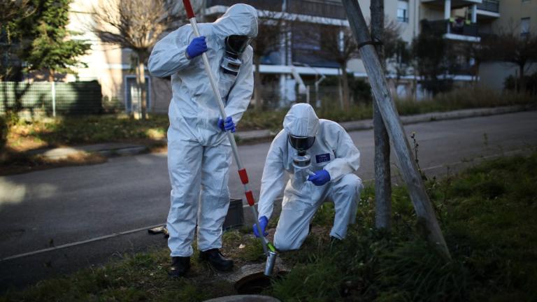 Firefighters from the Marins-Pompiers of Marseille extract samples of sewage water at a retirement home in Marseille, southern France, Thursday Jan. 14, 2021, to trace concentrations of COVID-19 and the highly contagious variant that has been discovered in Britain. (AP Photo / Daniel Cole)