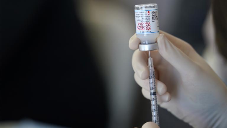 FILE - In this March 29, 2021 file photo, a worker readies syringes with the Moderna COVID-19 vaccine in Metairie, La. (AP Photo / Gerald Herbert, File)