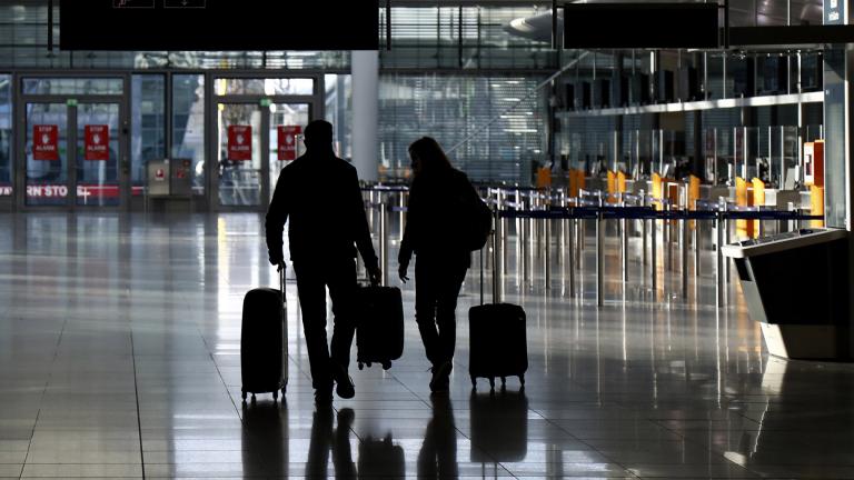 In this Saturday, Dec. 26, 2020 file photo, people walk with their luggage through a deserted check-in hall at the airport in Munich, Germany as Germany continues its second lockdown to avoid the further outspread of the coronavirus. (AP Photo / Matthias Schrader) In this Saturday, Dec. 26, 2020 file photo, people walk with their luggage through a deserted check-in hall at the airport in Munich, Germany as Germany continues its second lockdown to avoid the further outspread of the coronavirus. (AP Photo / Matthias Schrader)