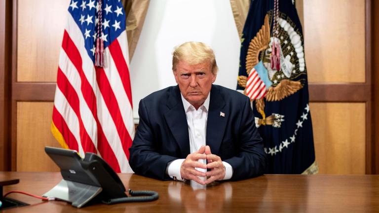 In this image provided by the White House, President Donald Trump listens during a phone call with Vice President Mike Pence, Secretary of State Mike Pompeo, and Chairman of the Joint Chiefs of Staff Gen. Mark Milley, Sunday, Oct. 4, 2020, in his conference room at Walter Reed National Military Medical Center in Bethesda, Md. (Tia Dufour / The White House via AP)