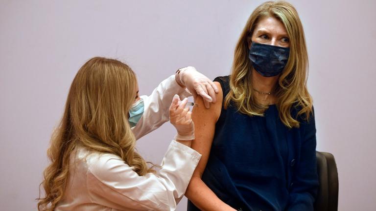 Granby kindergarten school teacher Christina Kibby receives the Johnson & Johnson COVID-19 vaccine by pharmacist Madeline Acquilano, left, at Hartford Hospital in Hartford, Conn., Wednesday, March 3, 2021.(AP Photo / Jessica Hill)