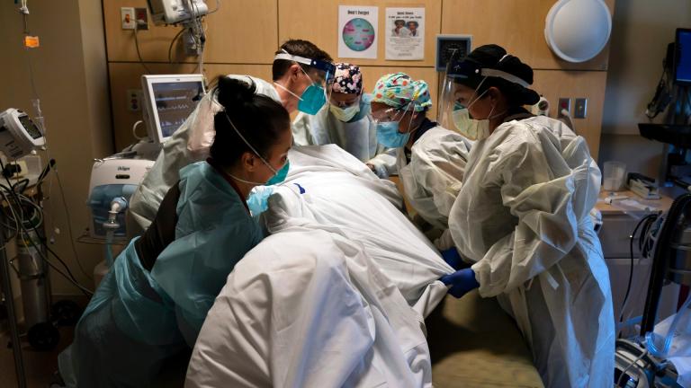 In this Nov. 19, 2020, file photo, medical personnel prone a COVID-19 patient at Providence Holy Cross Medical Center in the Mission Hills section of Los Angeles. (AP Photo / Jae C. Hong, File)