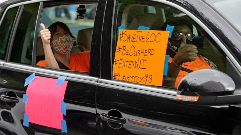 Motorists take part in a caravan protest in front of Senator John Kennedy’s office at the Hale Boggs Federal Building asking for the extension of the $600 in unemployment benefits to people out of work because of the coronavirus in New Orleans, La. Wednesday, July 22, 2020. (Max Becherer / The Advocate via AP)