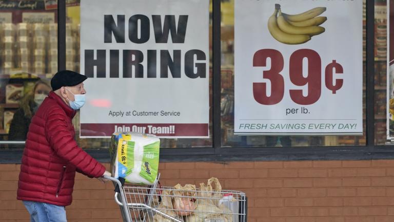 A man walks out of a Marc's Store, Friday, Jan. 8, 2021, in Mayfield Heights, Ohio. Fewer Americans applied for unemployment benefits last week, lowering claims to 900,000, still a historically high level that points to further job cuts in a raging pandemic. (AP Photo/Tony Dejak, file) A man walks out of a Marc's Store, Friday, Jan. 8, 2021, in Mayfield Heights, Ohio. Fewer Americans applied for unemployment benefits last week, lowering claims to 900,000, still a historically high level that points to further job cuts in a raging pandemic. (AP Photo/Tony Dejak, file)