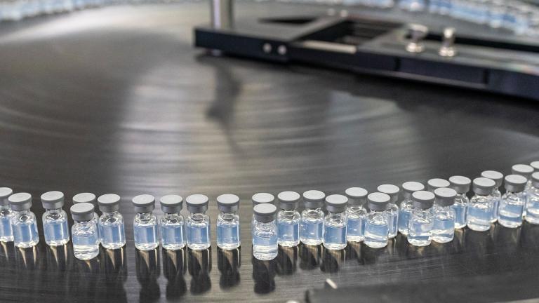 This August 2022 photo provided by Pfizer shows vials of the company’s updated COVID-19 vaccine during production in Kalamazoo, Mich. (Pfizer via AP)