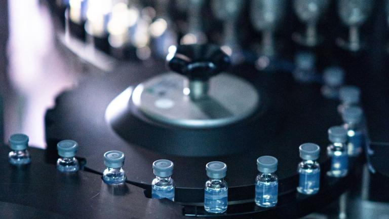 This August 2022 photo provided by Pfizer shows vials of the company’s updated COVID-19 vaccine during production in Kalamazoo, Mich. (Pfizer via AP)