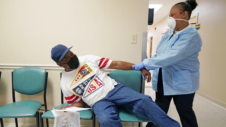 FILE - In this April 7, 2021, file photo, Wilbert Marshall, 71, left, pretends to be scared of receiving the COVID-19 vaccine from a nurse at the Aaron E. Henry Community Health Service Center in Clarksdale, Miss. (AP Photo / Rogelio V. Solis)