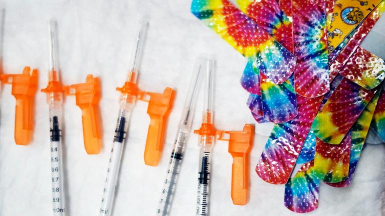 Syringes and colorful bandages are prepared as children from local schools prepare to get COVID-19 vaccines in Pittsfield, Mass., on Monday Dec. 13, 2021. (Ben Garver / The Berkshire Eagle via AP, File)