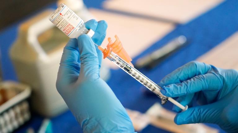 A nurse prepares a syringe of a COVID-19 vaccine at an inoculation station in Jackson, Miss., July 19, 2022. (AP Photo / Rogelio V. Solis, File)