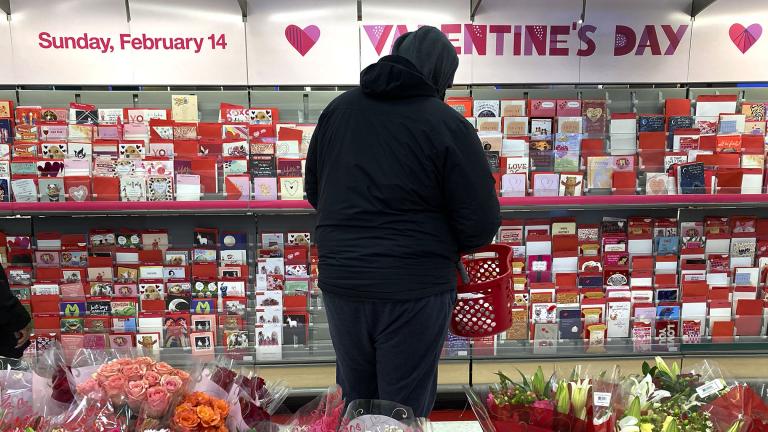 A shopper at a Chicago-area store looks over Valentine’s Day cards Saturday, Feb. 13, 2021. (AP Photo / Charles Rex Arbogast)