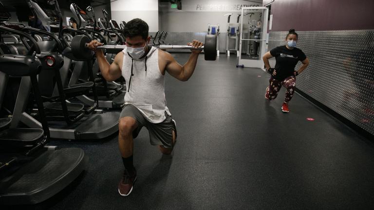 In this Friday, June 26, 2020 file photo, people wear masks while exercising at a gym in Los Angeles. (AP Photo / Jae C. Hong)