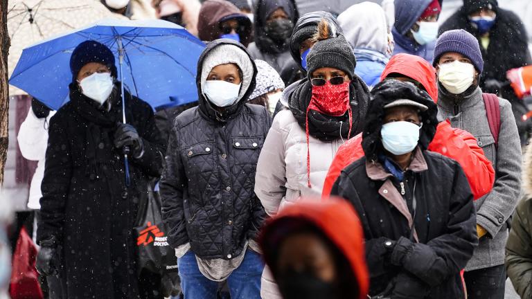 In this Feb. 19, 2021, file photo, people wait in line at a 24-hour, walk-up COVID-19 vaccination clinic hosted by the Black Doctors COVID-19 Consortium at Temple University’s Liacouras Center in Philadelphia. (AP Photo / Matt Rourke, File)