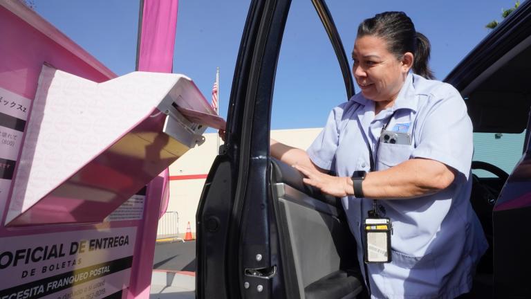 Yvonne Gali steps out of her car to cast her California primary ballot at a drop-off box outside the Sacramento County Registrar of Voters office in Sacramento, Calif., June 7, 2022. (AP Photo / Rich Pedroncelli, File)