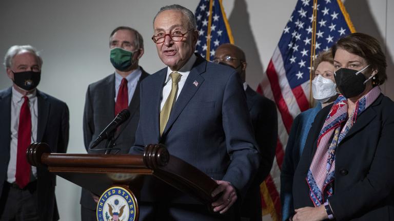 Senate Majority Leader Chuck Schumer, D-N.Y., speaks to reporters alongside, from left, Sen. Tim Kaine, D-Va., Sen. Jeff Merkley, D-Ore., Sen. Raphael Warnock, D-Ga., Sen. Debbie Stabenow, D-Mich., and Sen. Amy Klobuchar, D-Minn., during a press conference regarding the Democratic party's shift to focus on voting rights at the Capitol in Washington, Tuesday, Jan. 18, 2022. (AP Photo / Amanda Andrade-Rhoades)