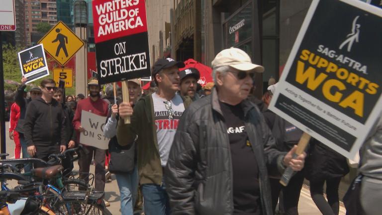 Hundreds protested outside the NBC Tower on May 17, 2023, in a show of support for the ongoing Writers Guild of America strike. (WTTW News)