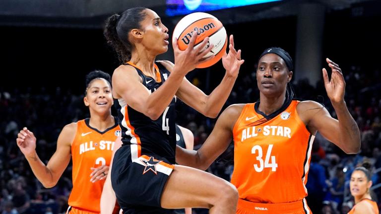 Team Stewart’s Skylar Diggins-Smith, center, drives to the basket against Team Wilson's Candace Parker, left, and Sylvia Fowles during the first half of a WNBA All-Star basketball game in Chicago, Sunday, July 10, 2022. (AP Photo / Nam Y. Huh)