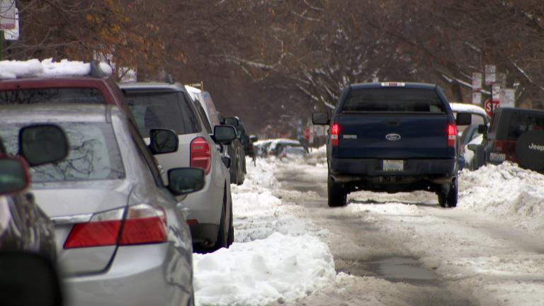 A snow-covered street in Chicago on Tuesday, Feb. 2, 2021 remains following a winter storm that blanketed parts of the area with more than a foot of snow over the weekend. (WTTW News)