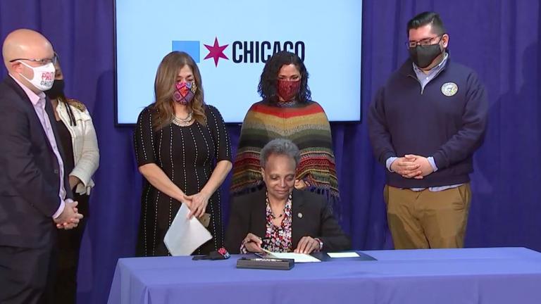 Mayor Lori Lightfoot signs a law designed to expand protections for undocumented immigrants. (Chicago Mayor’s Office / Twitter) 
