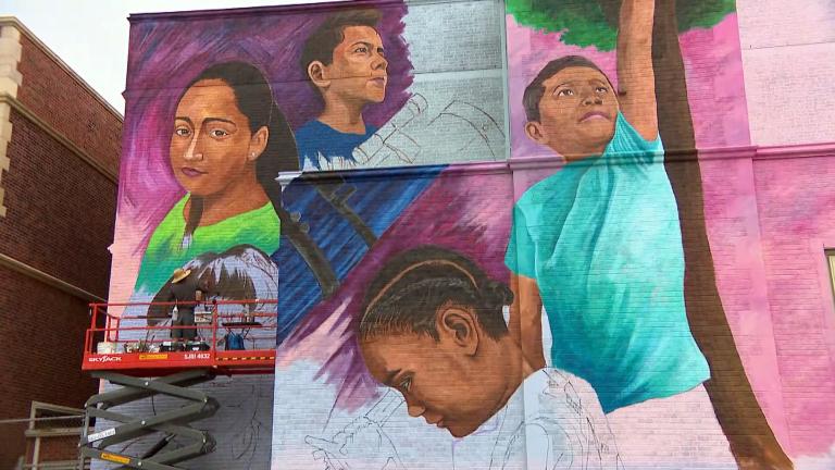 Gerardo Trujillo is principal of Louis Pasteur Elementary. He organized a mural to be painted on the side of the school, and says that he wanted to give the almost 100-year-old school building some color and inspiration for the community.  (WTTW News)