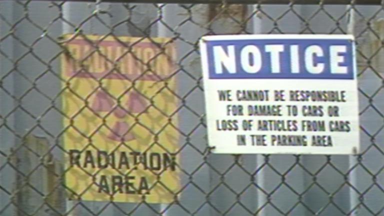Signs warning of radiation in West Chicago are pictured in 1990 file footage. (WTTW News)