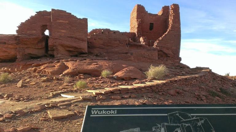 This photo shows the remains of a multilevel stone dwelling at Wupatki National Monument outside Flagstaff, Arizona, on Feb. 17, 2014. The monument has been evacuated twice during spring 2022 because of wildfires. (AP Photo / Felicia Fonseca)