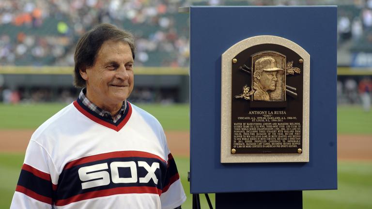 In this Aug. 30, 2014, file photo, former Chicago White Sox manager Tony La Russa stands with his Baseball Hall of Fame plaque before the second baseball game of a doubleheader against the Detroit Tigers in Chicago. (AP Photo / Matt Marton, File)