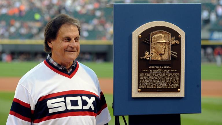 In this Aug. 30, 2014, file photo, former Chicago White Sox manager Tony La Russa stands with his Baseball Hall of Fame plaque before the second baseball game of a doubleheader against the Detroit Tigers in Chicago. (AP Photo / Matt Marton, File)